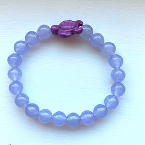 This is a very pretty glass bead, purple turtle bracelet